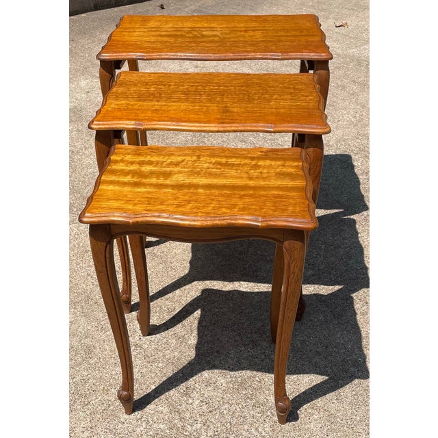 Beautiful set of three French country nesting tables! Measurements listed are of the larger table