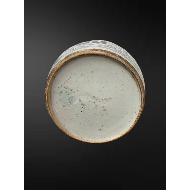 Qing dynasty, 19th century A charming Chinese blue and white ovoid ginger jar and flat cover, painted in soft tones of...