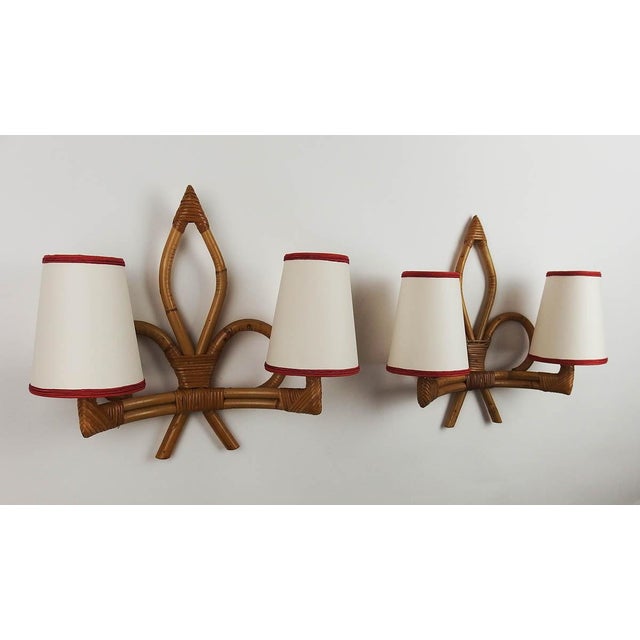 Pair of rattan wall sconces with two lights. France Up to 250V (Europe/UK Standard).The wiring of this item may be...