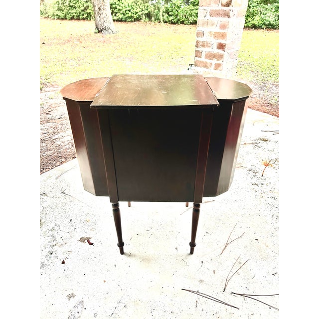 Beautiful antique mid to late 19th century mahogany sewing table featuring a classic early American–inspired form with...