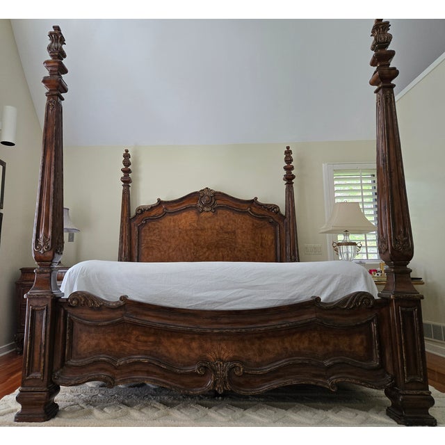 The Verona Eastern King Poster Bed commands attention with its burlwood inlaid headboard and regal silhouette, making it...