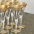 1960s Heavy Gold Flecks on Clear Crystal Glass All Purpose Wine Champagne Flutes- Set of 7 For Sale - Image 9 of 12