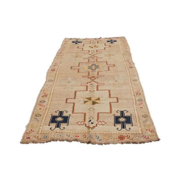Handknotted vintage washed out wool rug from Kars region of Turkey. Approximatelly 50-60 years old. In very good condition.
