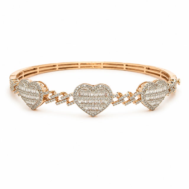 Romantic with a modern edge, this 10K Rose Gold bangle bracelet features a heart-inspired design set with round and...