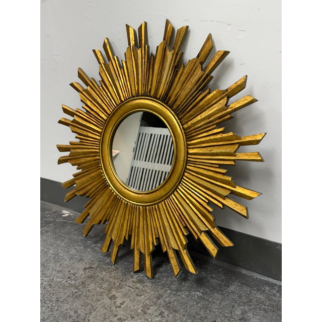 Design Plus Gallery presents the Sunburst Wall Mirror from Creative Co-Op. This decorative mirror showcases a dramatic...