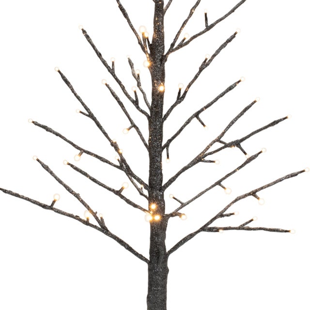 Add a touch of elegance to your holiday decor with the LED Black Glittered Twig Tree. Standing 36" tall, this stunning...
