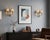 Pair of double-arm wall sconces dating to the 1970s. Clear moulded acrylic arms curve outward from round brass backplates...