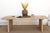 The appeal of this design is how little it asks for. Two solid slab legs of reclaimed wood, cut to a clean 2.75 inches...
