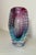 This vintage hand-blown Italian Murano glass vase is a stunning piece of studio glass that showcases the craftsmanship and...