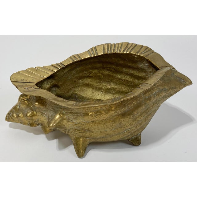 Vintage nautical style brass conch seashell planter. Footed with a lovely patina.