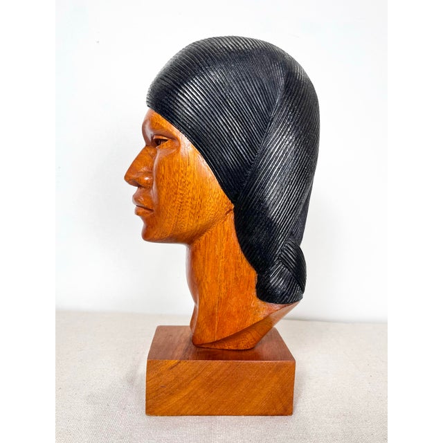 Vintage hand carved wood bust. Made in Bolivia. Beautiful rich honey tone wood carved into a bust of an indigenous native...
