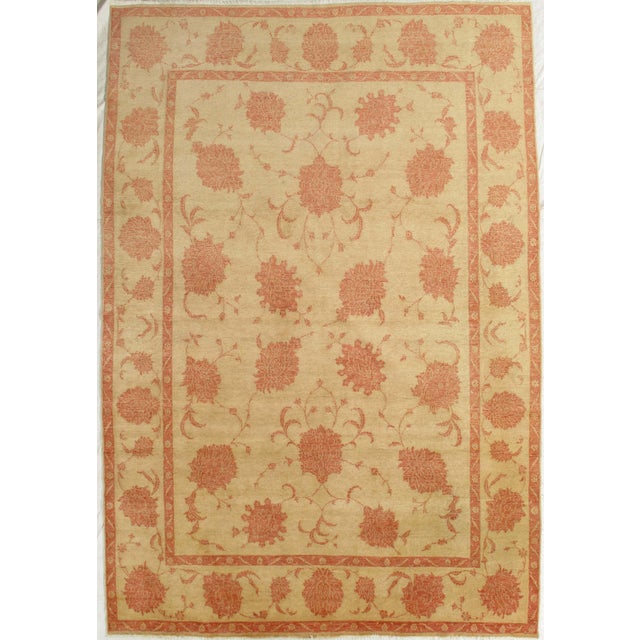 Vintage hand-knotted Persian Sultanabad-style wool rug with an ivory field and soft terracotta floral motifs arranged in...