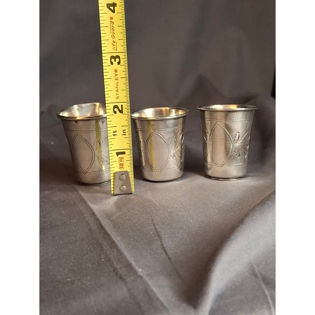 This is believed to be a rare and exceptional matching set of three (3) antique French silver Kiddush cup beakers or shot...