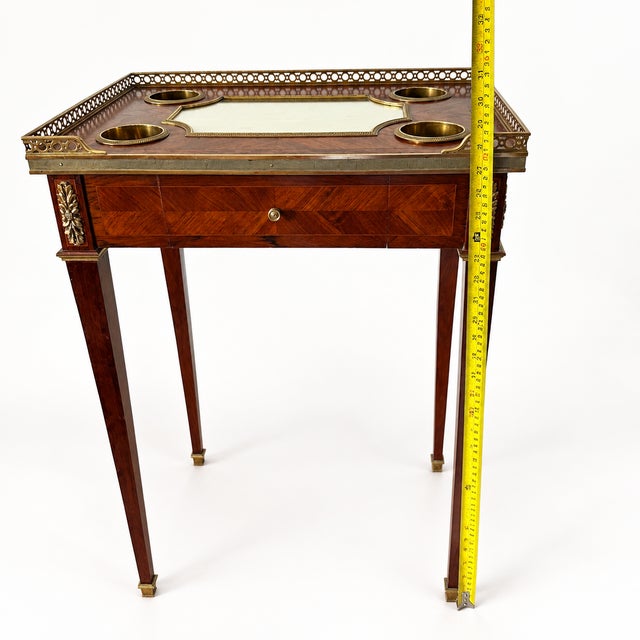 Rare antique French Louis XVI style marquetry salon table from the Napoleon III period, dating to the second half of the...