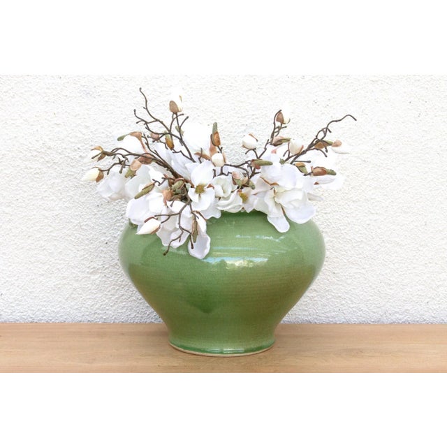 This magnificent pot is a commanding piece defined by its striking color and substantial form. This antique Chinese...