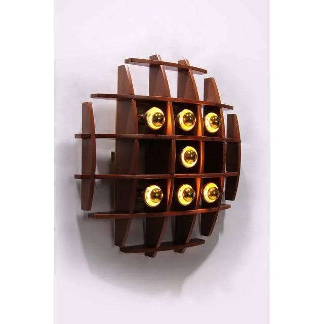 Iconic wooden wall lamp by angelo brotto, 1960s design discover the timeless elegance of the angelo brotto wall lamp, a...