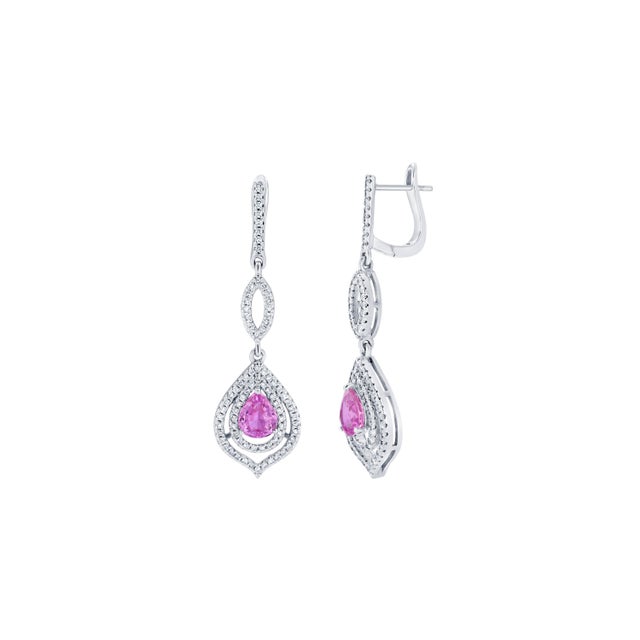 There are 2 Pear Cut Pink Sapphires that weigh 2.05 carats and are surrounded by 164 Round Cut Diamonds that weigh 0.85...