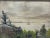 Early 20th-century oil on board coastal landscape depicting a tranquil shoreline scene with a sailboat drifting across...