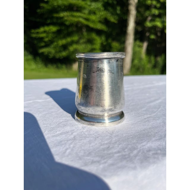 Single vintage hotel silver creamer or small pitcher with spout and handle.