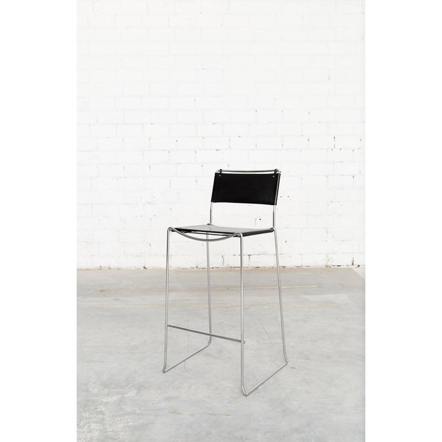 Italian industrial designer Giandomenico Belotti designed this postmodern stackable bar stool in the early 1980s. Frame...