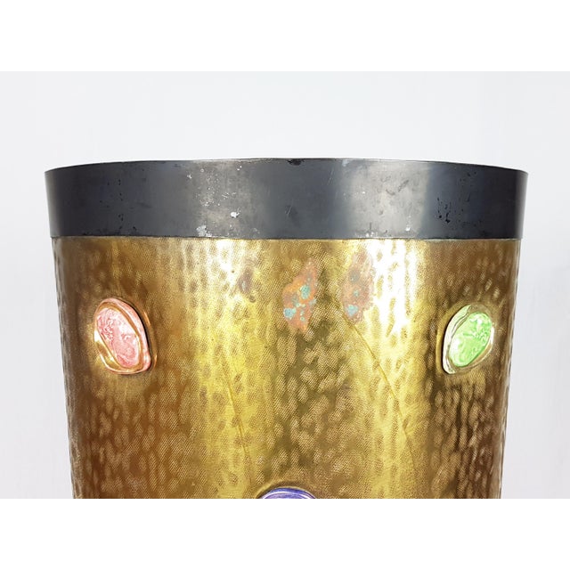This elegant umbrella stand was manufactured in Italy in the 1950s. It is made from an engraved brass sheet with two black...
