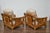 A set of two bamboo lounge chairs with their ottoman from the Midcentury period, with rattan accents and custom linen...
