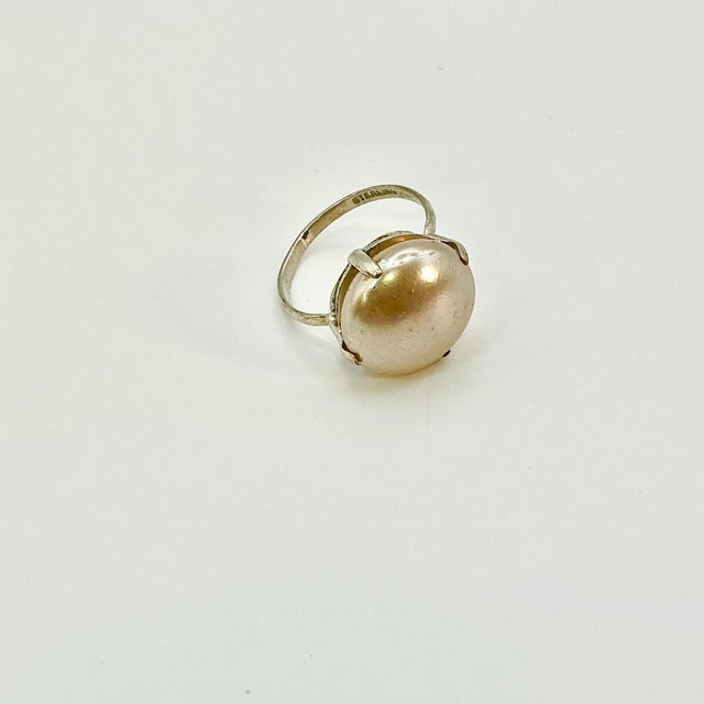 Vintage Home is pleased to offer this 1940s Art Deco Hollywood Regency Mother-of-Pearl Cocktail Ring set in Sterling...