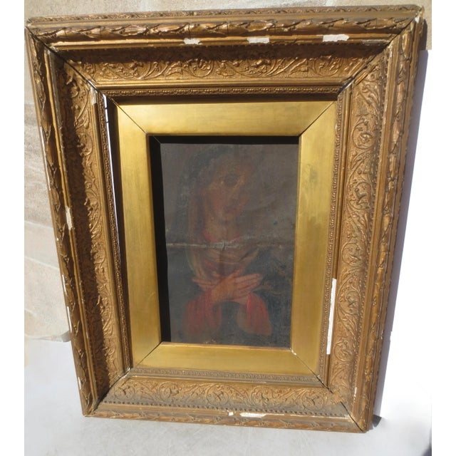 17th-century painted Retablo of the Madonna. Serious religious art of the Madonna in adoration posture. Mexican art on a...