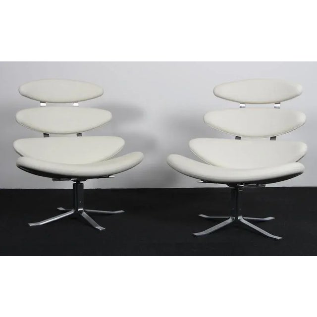 Poul M. Volther lounge chair in original white leather. Frame of brushed steel. Model EJ-5 Corona, made by Erik Jørgensen....