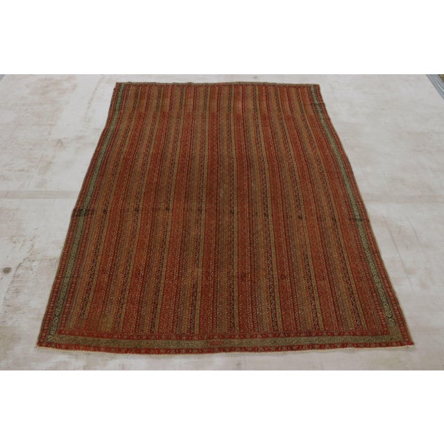 This 4x6 antique Persian Senneh rug is a very special curation of Moharamati design—made with hand-knotted wool circa...