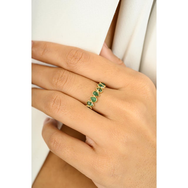 1.78 Carat Pear Cut Natural Emerald 18k Yellow Gold Full Eternity Band Ring symbolizes the everlasting love between a...