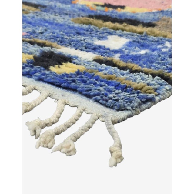 Boujad Rug | Handwoven Berber Wool Rug with Blue Field and Figural Design This striking Boujad rug features a deep indigo-...