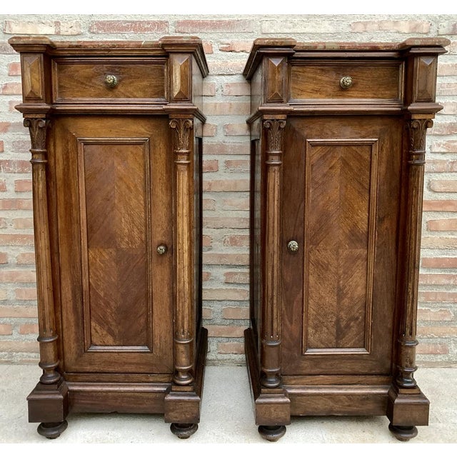Pair of French Louis XVI side cabinets with side columns with acanthus leaf decoration, late 19th century. Red marble top....