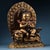 This intricately cast bronze sculpture depicts Manjushri Bodhisattva, the bodhisattva of wisdom, seated gracefully atop a...