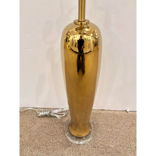 Modern Currey & Co Tall Porcelain Lamp with Brass Metallic Glaze on round acrylic base. Showroom floor sample.