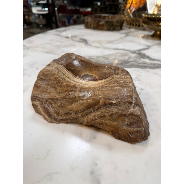 Vintage ashtray hand-carved from solid brown marble with striking cream, caramel, and dark brown veining. Features a...