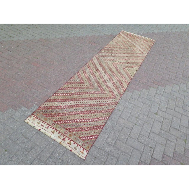 This beautiful, traditional vintage, hand knotted Turkish runner is approximately 60 years old. It is handmade of very...