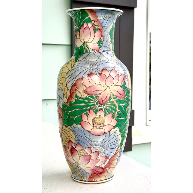 Vintage Chinese enameled porcelain vase from the 1970s. Features a hard-to-find water lily motif. The vase is hand-painted...