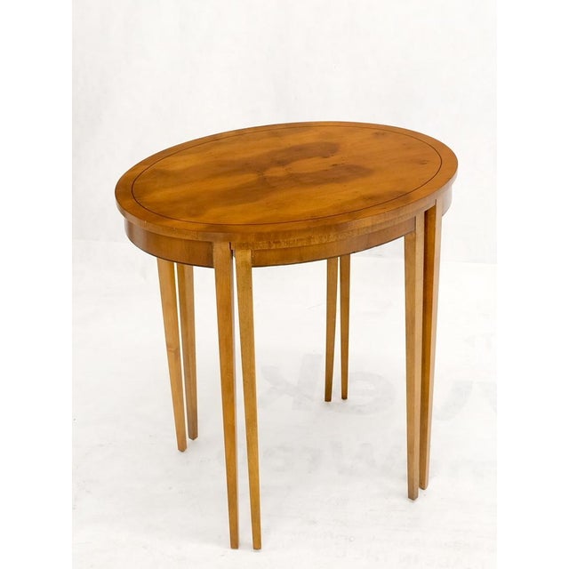 Set of oval Baker nesting stacking side end lamp tables stands.