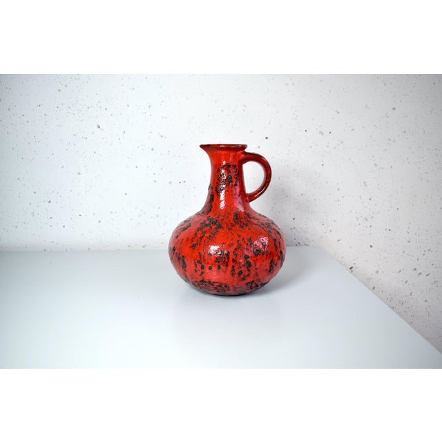 This is a red Fat Lava ceramic vase by Scheurich. Made in West Germany in the 1960s. Dimensions: Height: 25 cm Depth: 20...