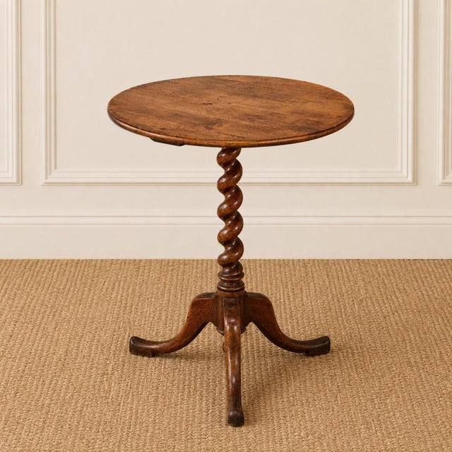 Crafted in England during the 19th century, this charming oak round table showcases the timeless appeal of traditional...