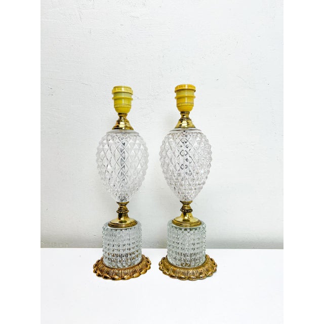A set of Mid-Century carved glass or Crystal Table Lamps in the shape of a pineapple with decorated brass details....