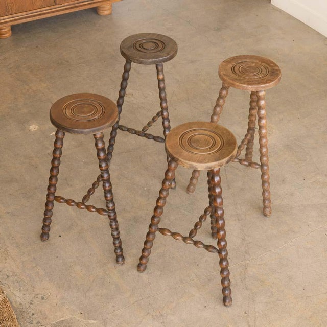 Vintage wood stool with beautiful wavy wood legs from France. Circular seat with unique carved ring detail on top....