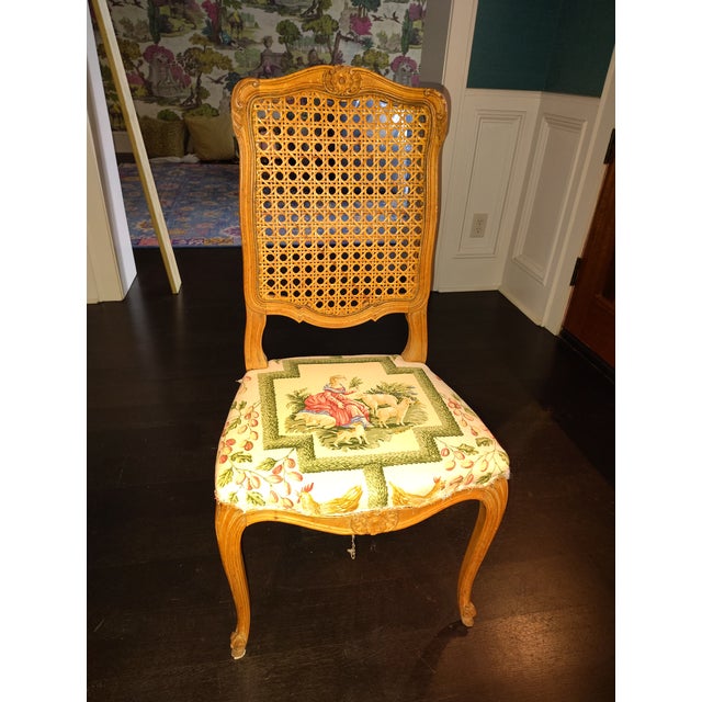 6 Vintage French Provincial Louis XV Style Dining Room Chairs featuring a carved wood frame, a woven cane back, and...
