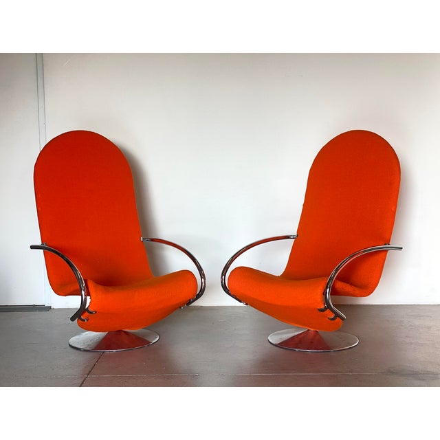 Pair of swivel armchairs series 1 2 3 by Verner Panton designed in the 70s and produced by Fritz Hansen, model with high...