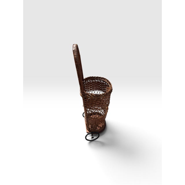 Wood Early 20th Century Handwoven Wicker Rolling Market Basket With Iron Wheels For Sale - Image 7 of 9