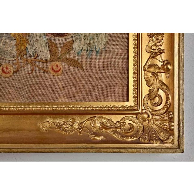 Religious motif. Woven with colored wool. In a gilded frame. Dimensions: 63.5 x 81.5cm, frame width: 7cm.