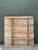 Defined by expansive proportions and soft architectural curves, this vintage solid oak étagère features a multi-tiered...