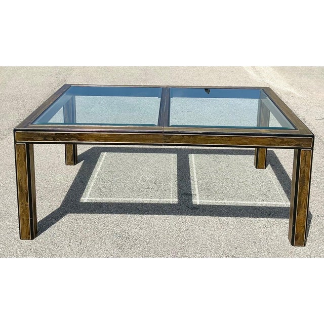 This striking vintage dining table showcases a sophisticated interplay of materials inspired by the celebrated work of...