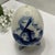 Vintage Porcelain Egg Pepper Shaker in Delft-Style Blue and White With Windmill Scene. Pepper shaker has hand painted...